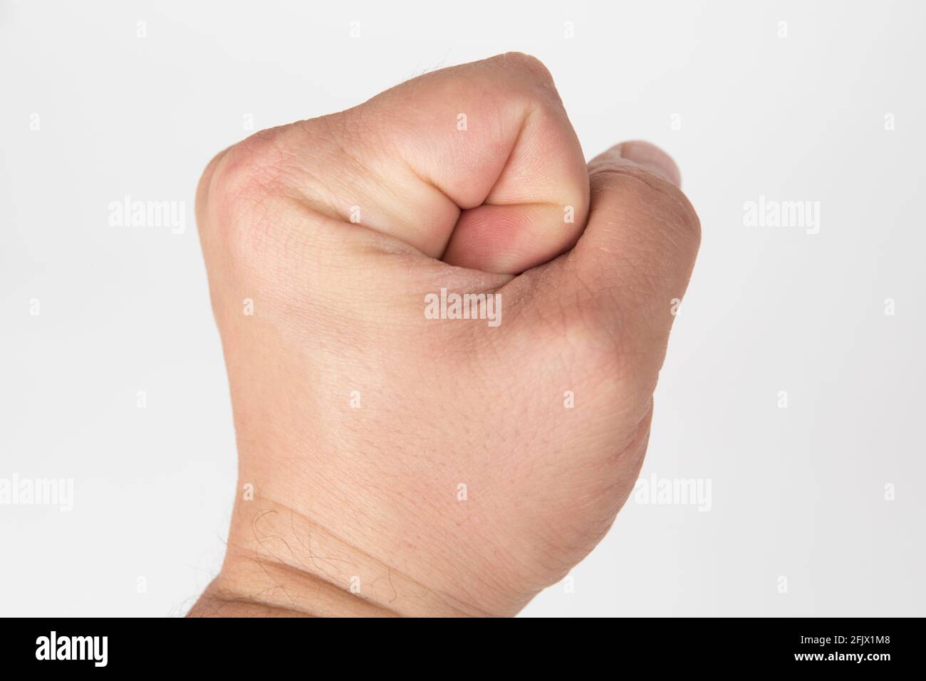 Poing sur fond blanc. Fermer, upwiev Banque D'Images