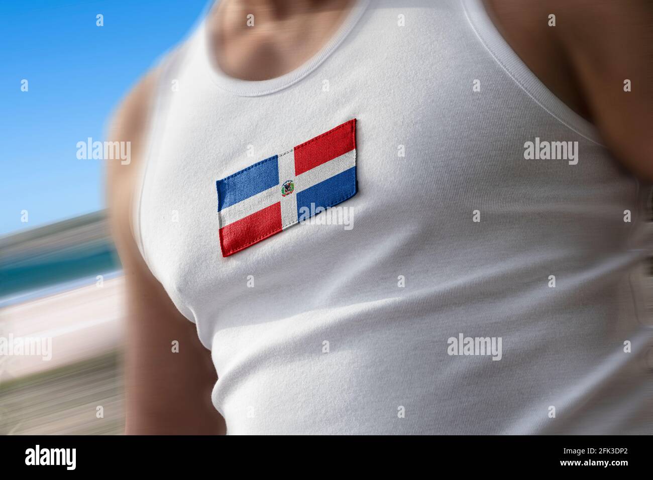 Le drapeau national de Dominicana sur la poitrine de l'athlète Banque D'Images
