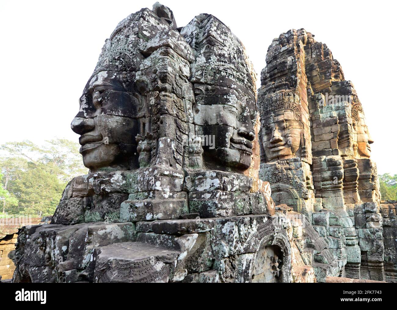 Faces en pierre au temple de Bayon à Siem Reap, Cambodge. Banque D'Images