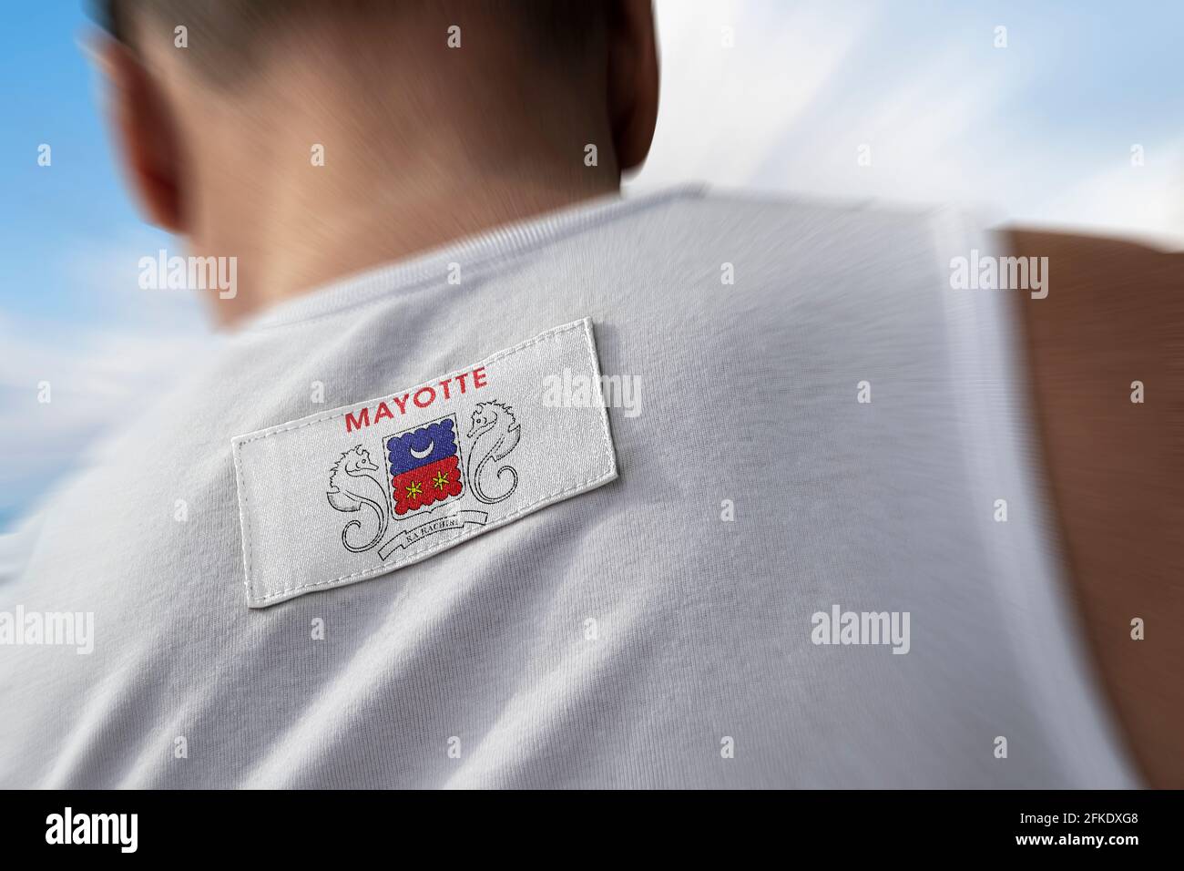 Le drapeau national de Mayotte sur le dos de l'athlète Banque D'Images