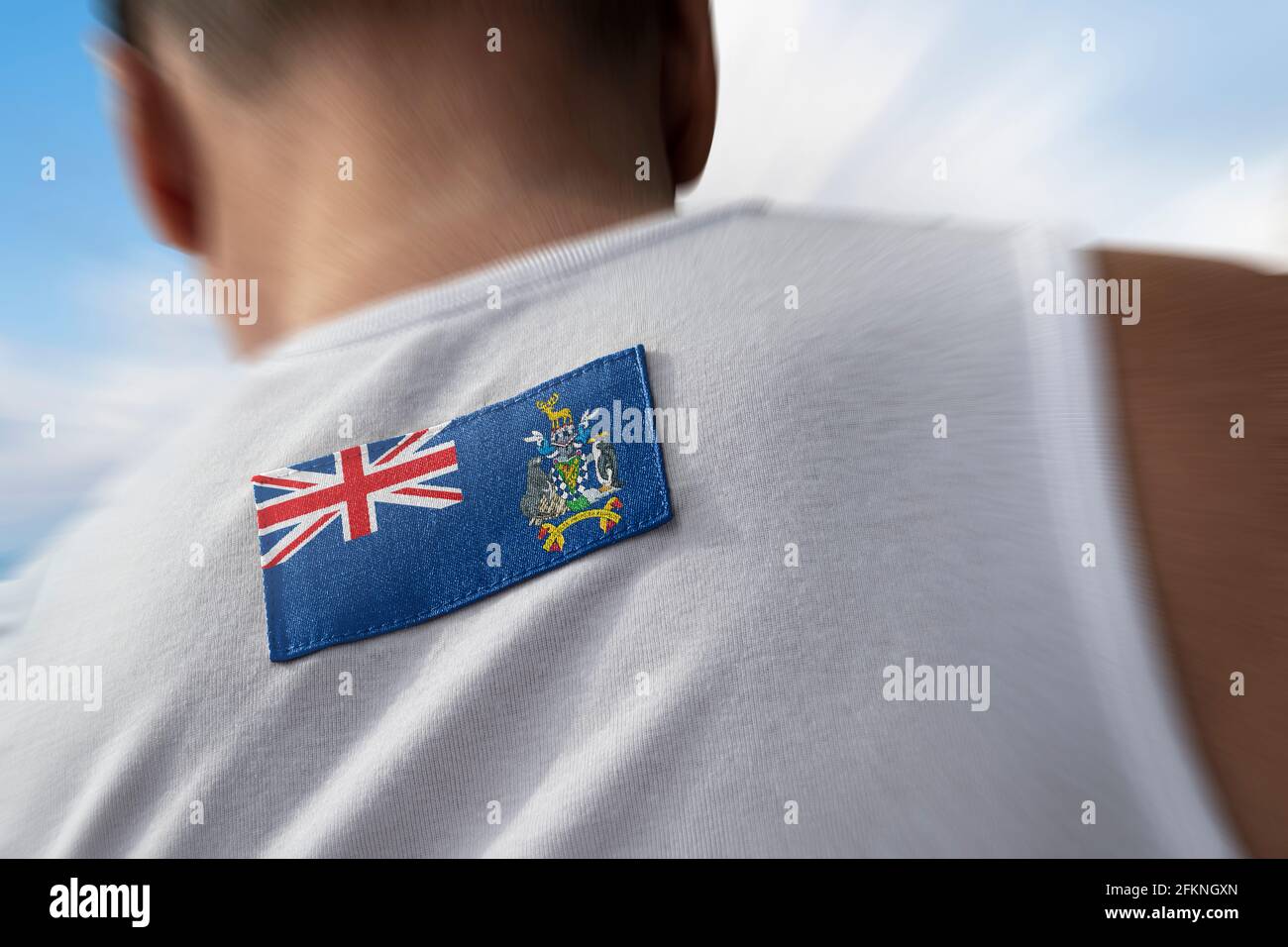 Le drapeau national de la Géorgie du Sud et du Sandwich du Sud Îles sur le dos de l'athlète Banque D'Images