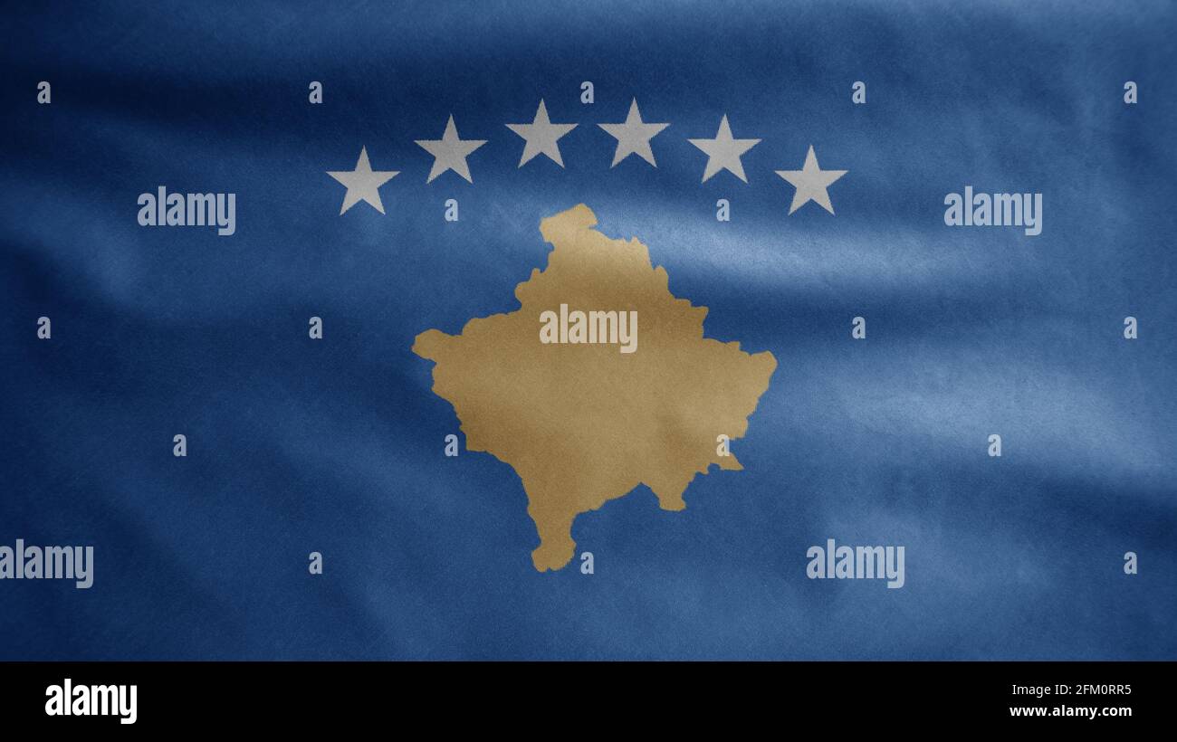 Drapeau kosovan agitant dans le vent. Gros plan de la bannière du Kosovo, soie douce et lisse. Tissu texture ensign arrière-plan. Banque D'Images