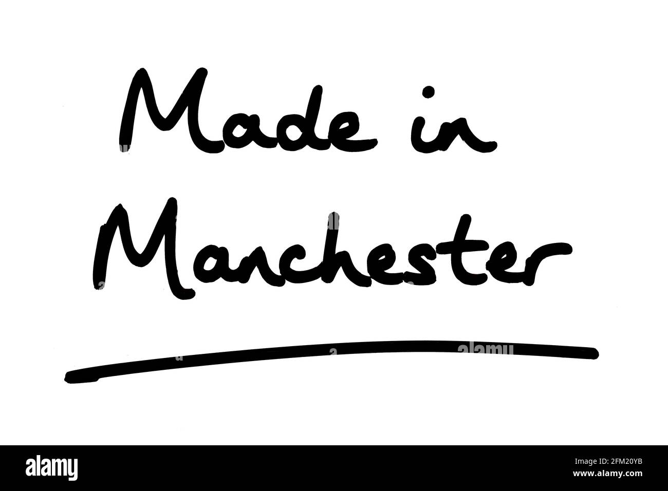 Fabriqué à Manchester, manuscrit sur fond blanc. Banque D'Images
