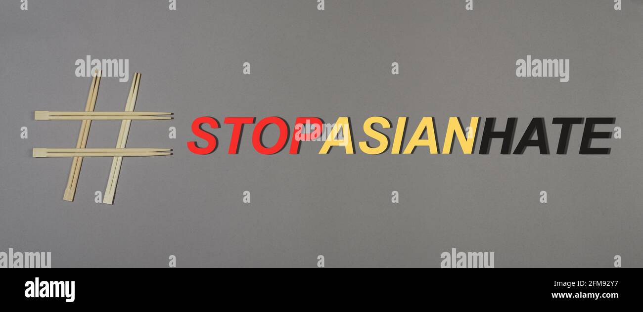 Arrêter le concept de haine asiatique. Bannière avec des baguettes hashtag et mot stop haine asiatique Banque D'Images