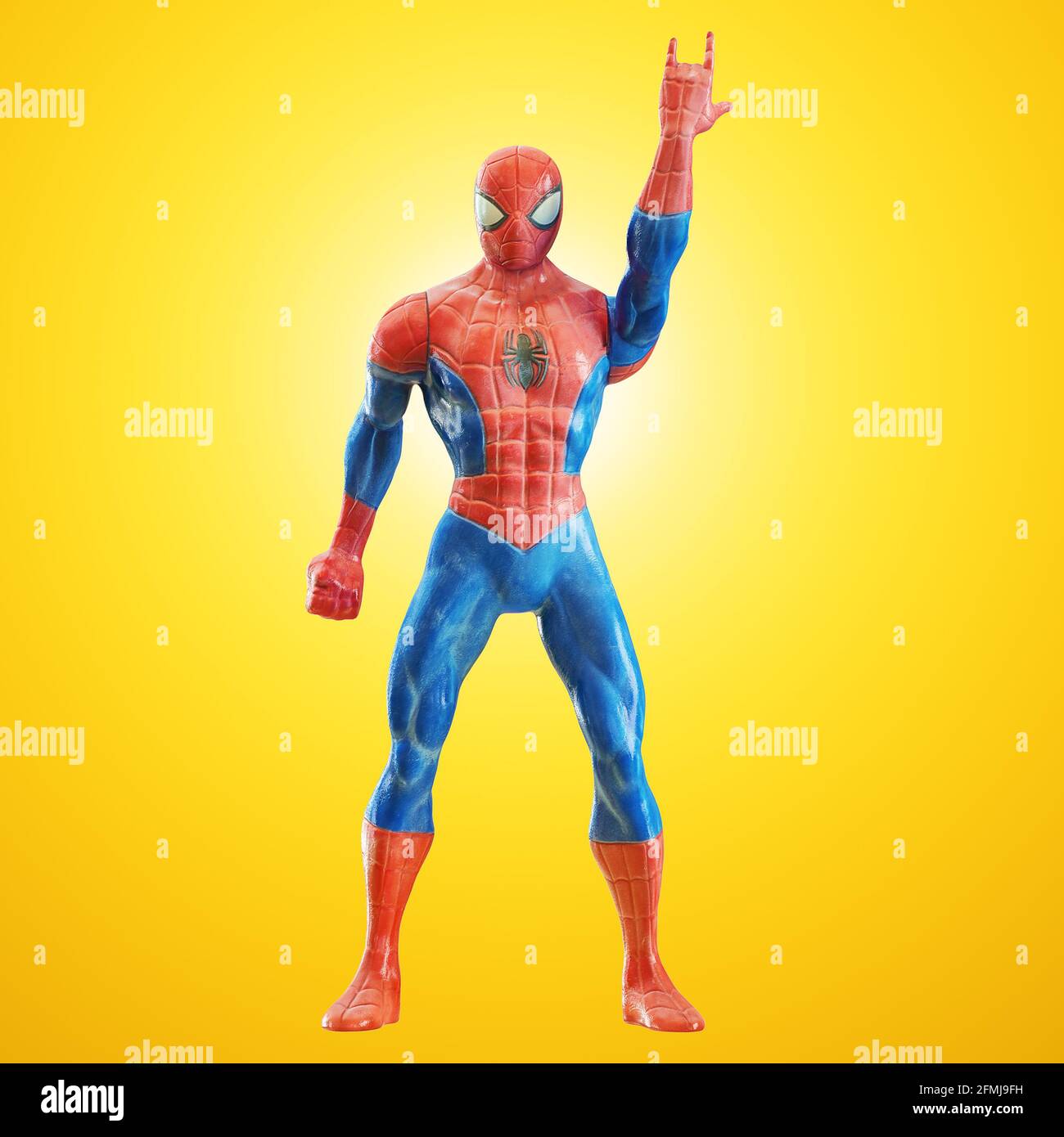 Spiderman de jouet avec la main levée montrant le rock et le