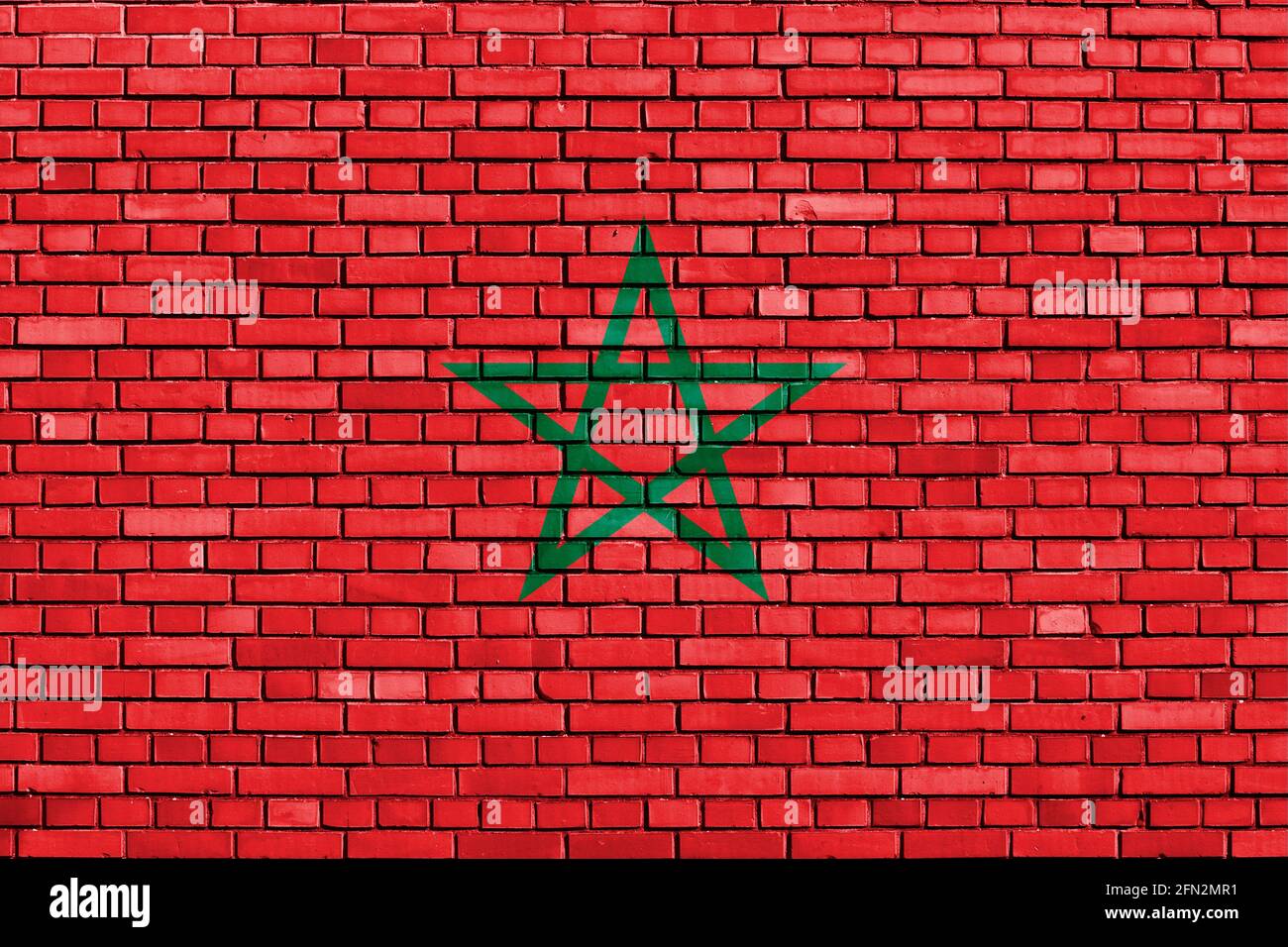 Drapeau du Maroc peint sur un mur de briques Banque D'Images