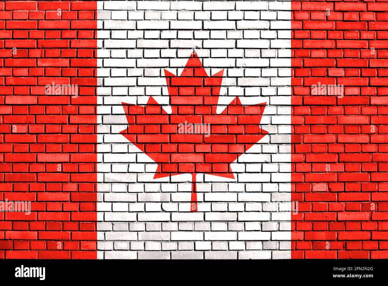 Drapeau du Canada peint sur mur de brique Banque D'Images