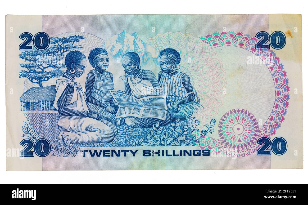 Inverse d'une note de Shilling de 1986 de la Banque centrale du Kenya en 20, montrant des filles lisant un journal. Banque D'Images