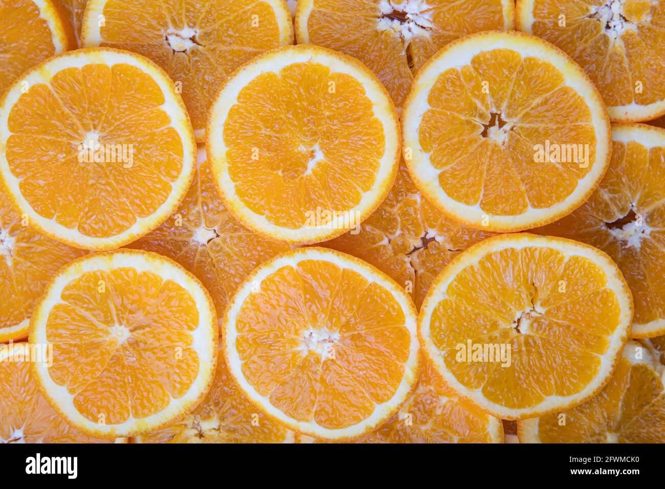 Couper les tranches de fruits orange, image de motif. Banque D'Images