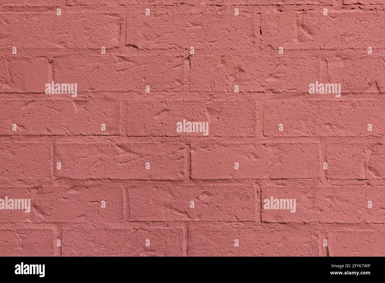 Gros plan de la texture de mur de briques orange peintes. Banque D'Images