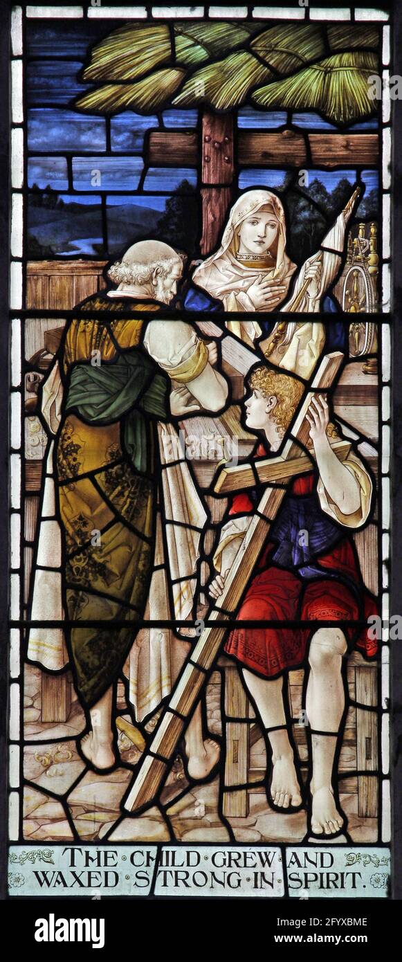 Vitraux représentant la Sainte famille dans l'atelier du charpentier, Église Lady St Mary, Wareham, Dorset Banque D'Images