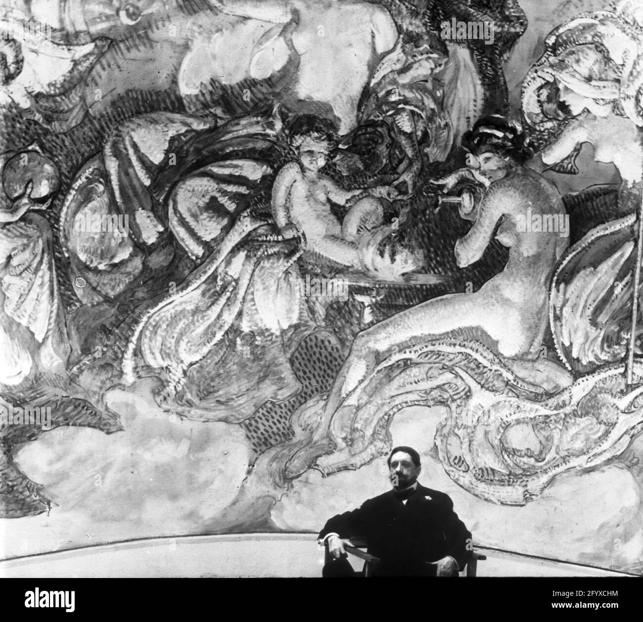 Un artiste pose devant une grande fresque à l'exposition internationale Century of Progress, également connue sous le nom de Chicago World's Fair, Chicago, Illinois, 1933. (Photo de Burton Holmes) Banque D'Images