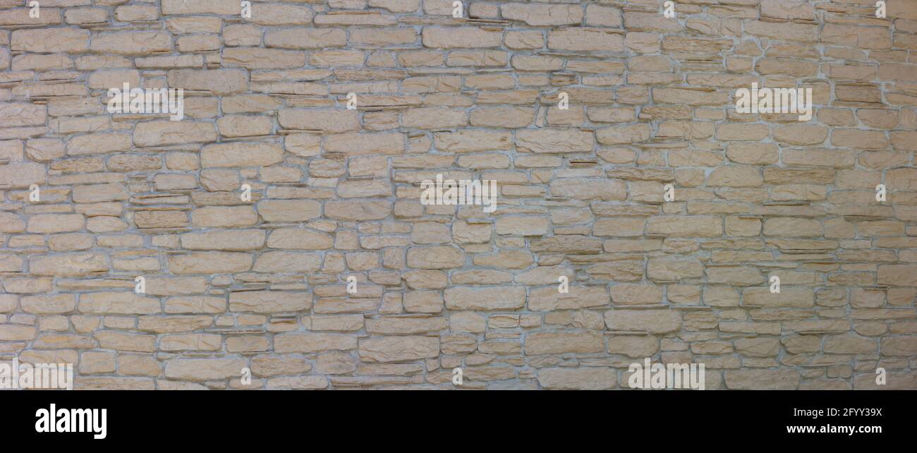 Motif de pierre décorative sur le mur. Façade de mur de maison arrière-plan. Banque D'Images