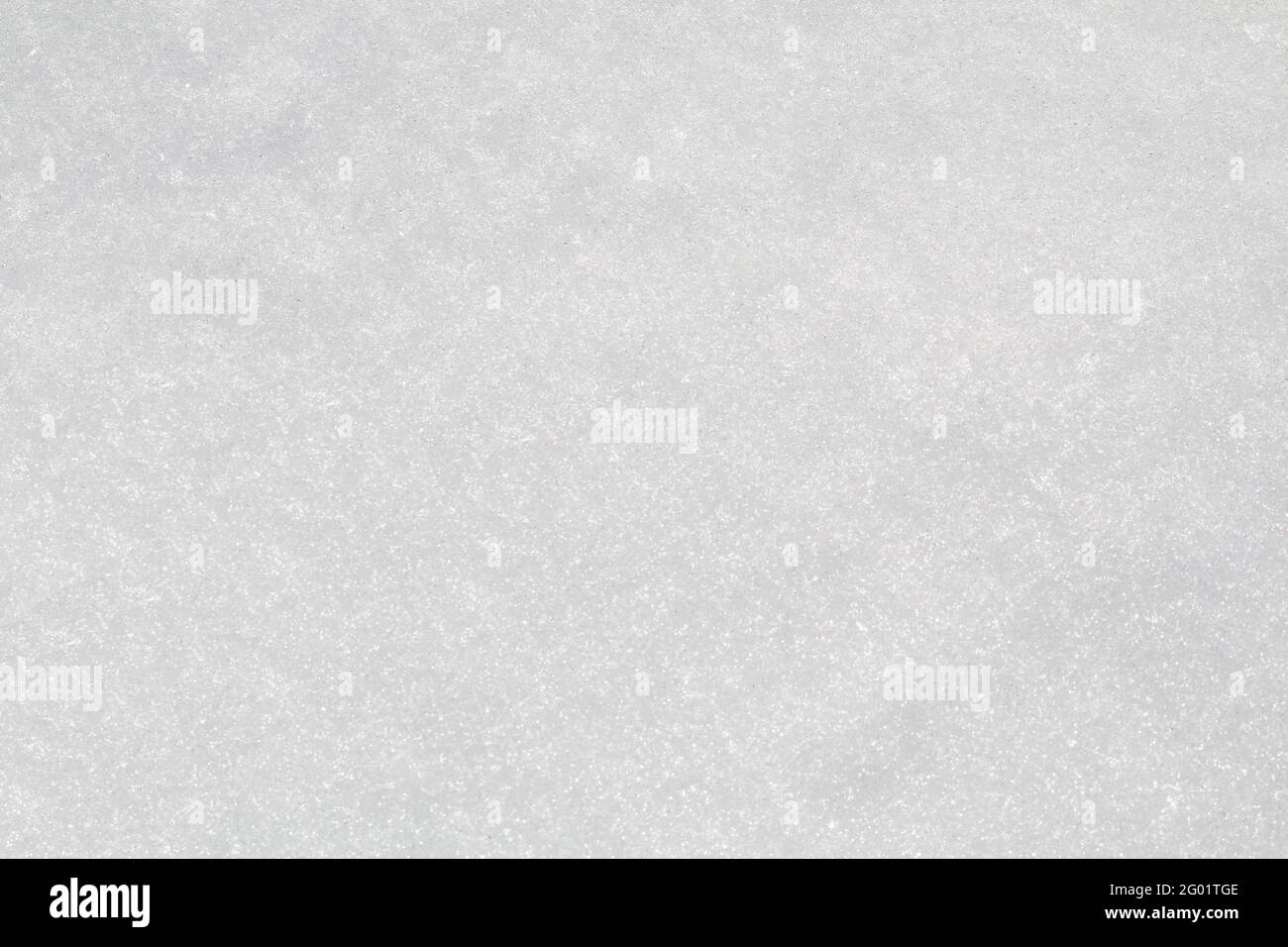 Neige d'hiver. Texture de la neige vue de dessus de la neige. Texture pour le design. Texture blanche enneigée. Flocons de neige. Banque D'Images