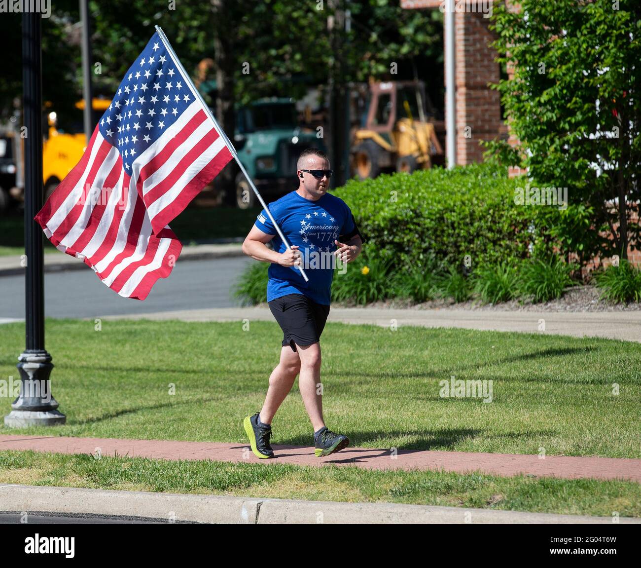 Jogging avec drapeau américain Banque D'Images