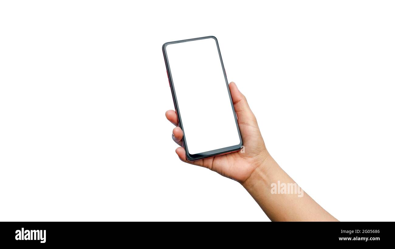 Gros plan d'une jeune femme main tenant un téléphone portable, écran blanc séparé sur fond blanc avec un masque. Banque D'Images