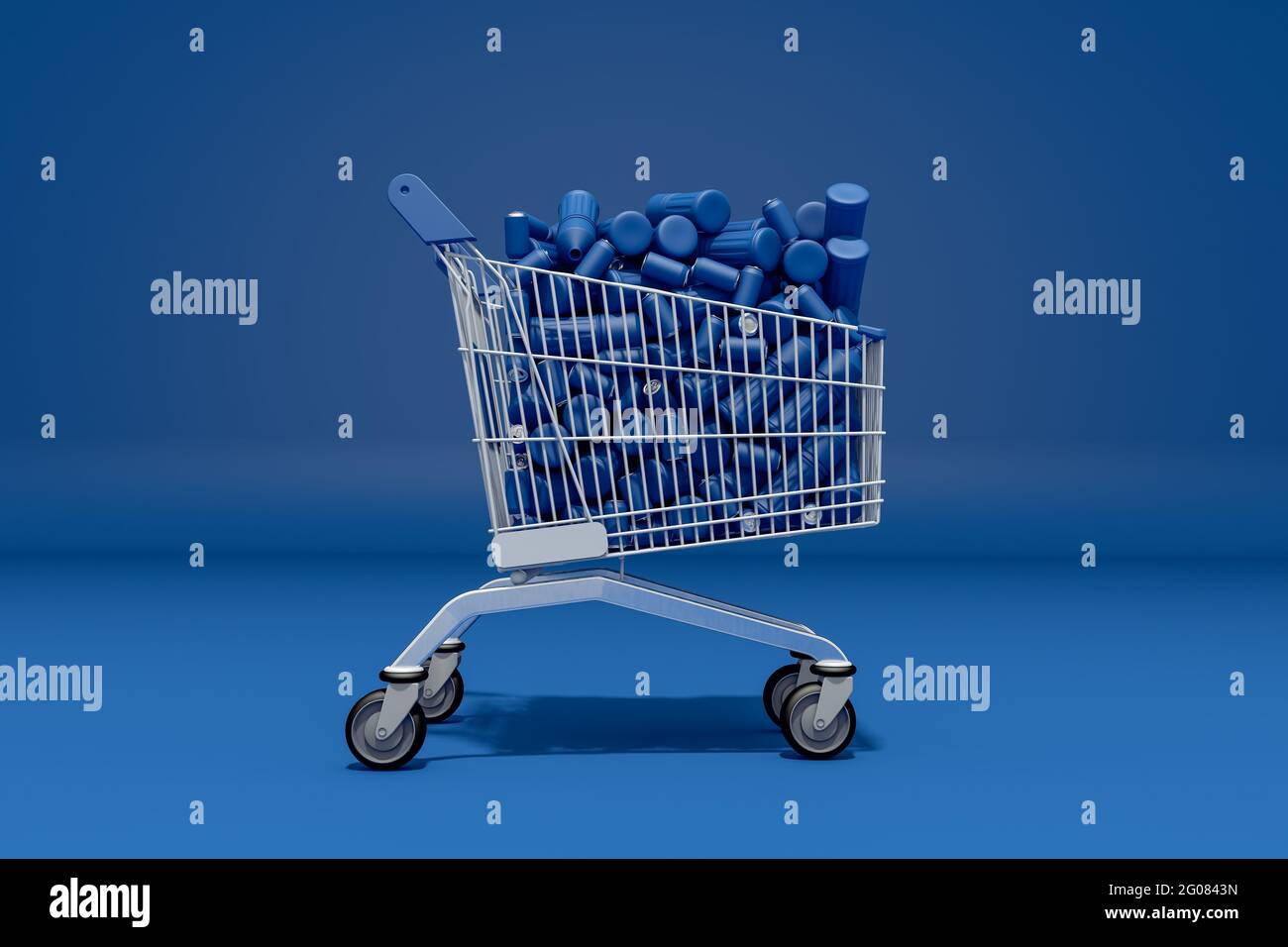 Concept de bouteilles en plastique et de boîtes bleues dans un chariot de supermarché. Déchets et pollution. Banque D'Images