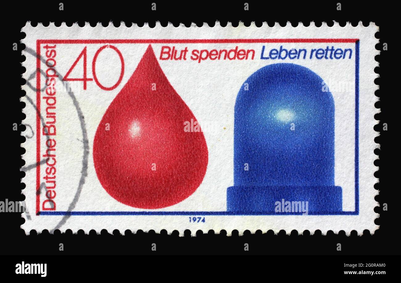 Un timbre imprimé en Allemagne montre le sang et la lumière de voiture de police, le service de don de sang en conjonction avec le service d'urgence d'accident, vers 1974 Banque D'Images