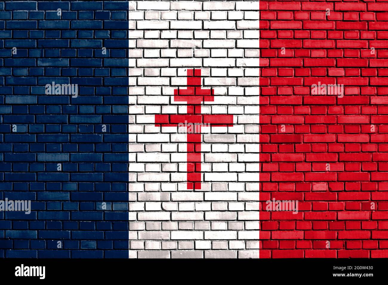 Drapeau historique de la France libre sur un mur de briques Banque D'Images