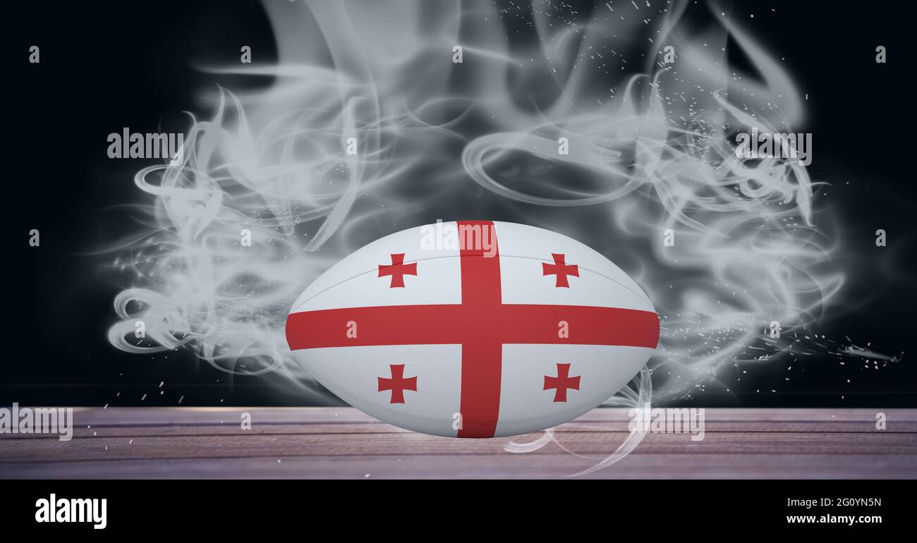 Composition du ballon de rugby du drapeau de géorgie sur fond noir avec fumée blanche Banque D'Images Composition du ballon de rugby du drapeau de géorgie sur fond noir avec fumée blanche Banque D'Images