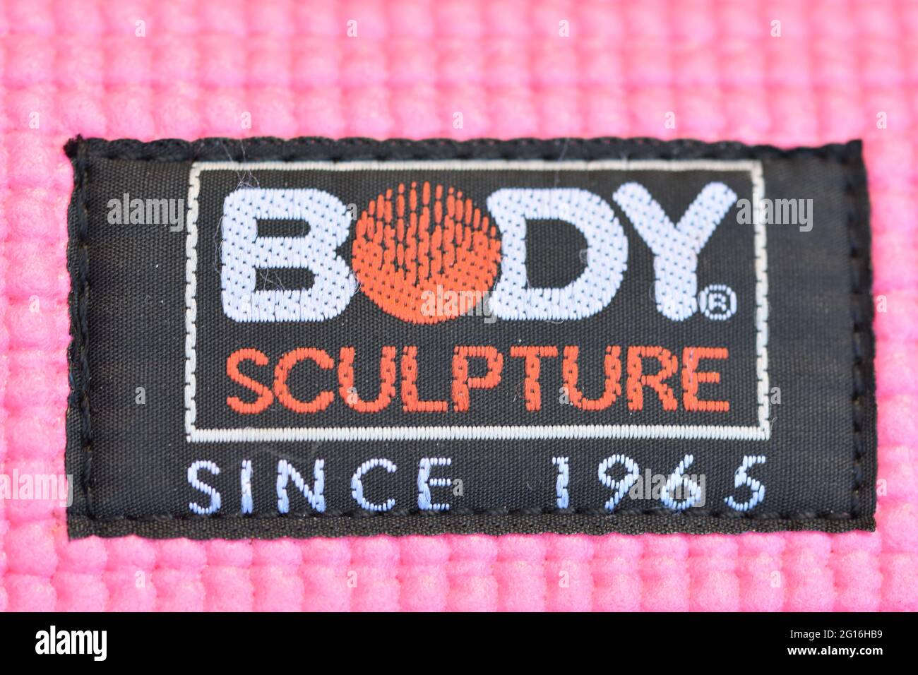 The Body Sculpture depuis 1965 logo en noir, blanc et orange cousu dans un  tapis de gym/yoga Photo Stock - Alamy