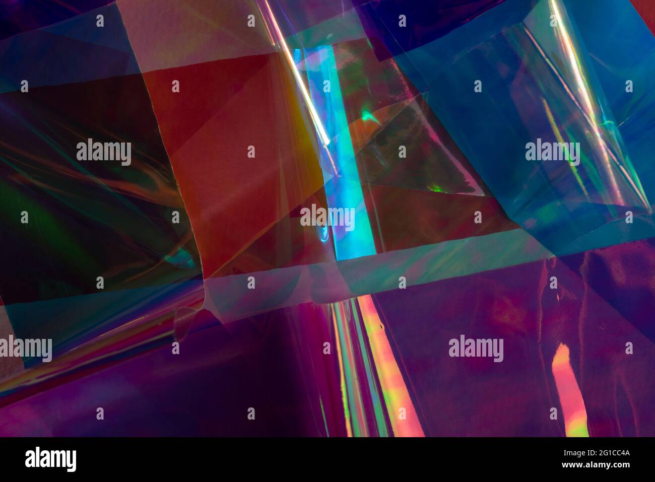 Arrière-plan holographique abstrait multicolore. Couleurs éclatantes, style rétro futuriste. Banque D'Images
