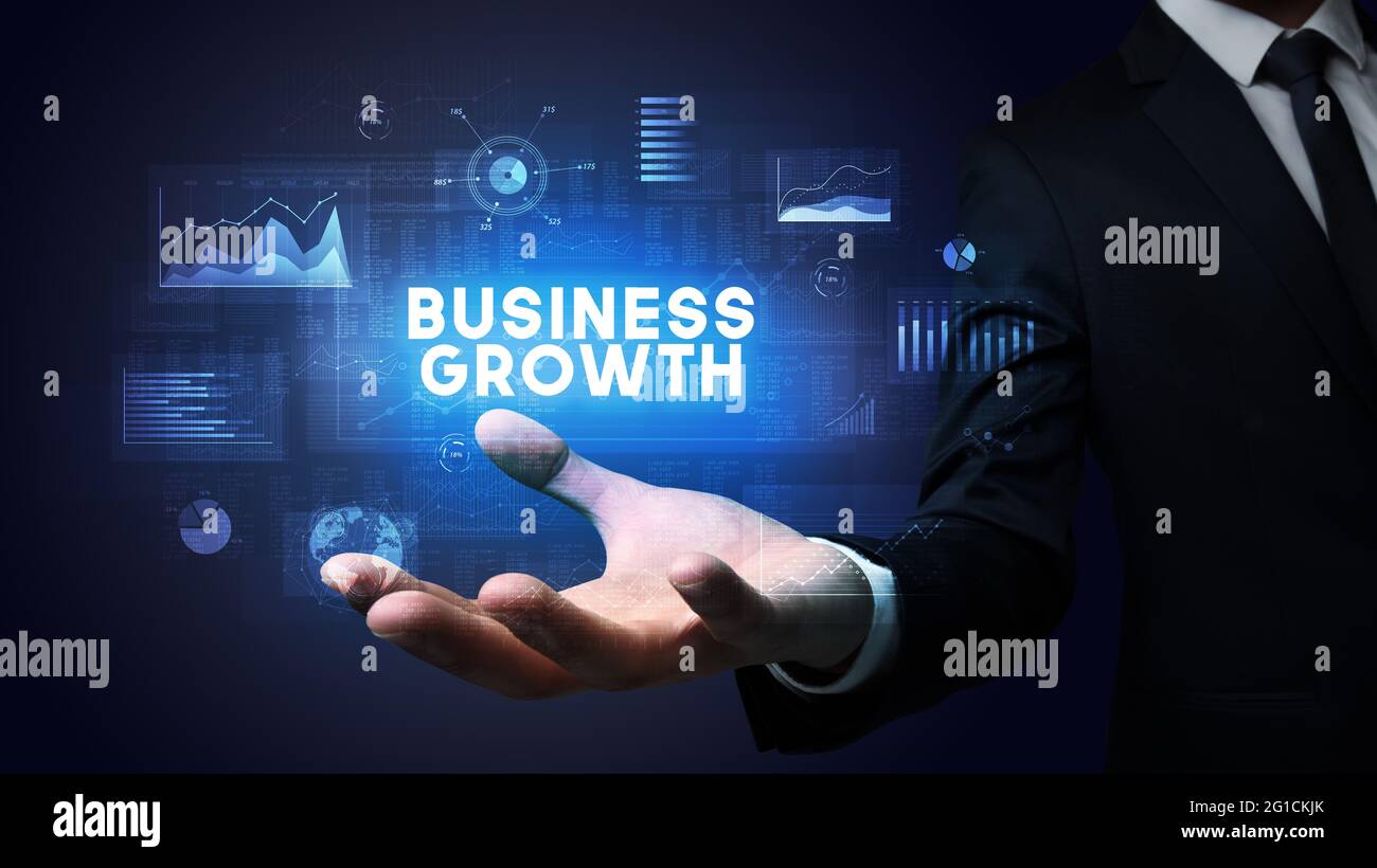 Main d'homme d'affaires tenant le message de motivation Banque D'Images