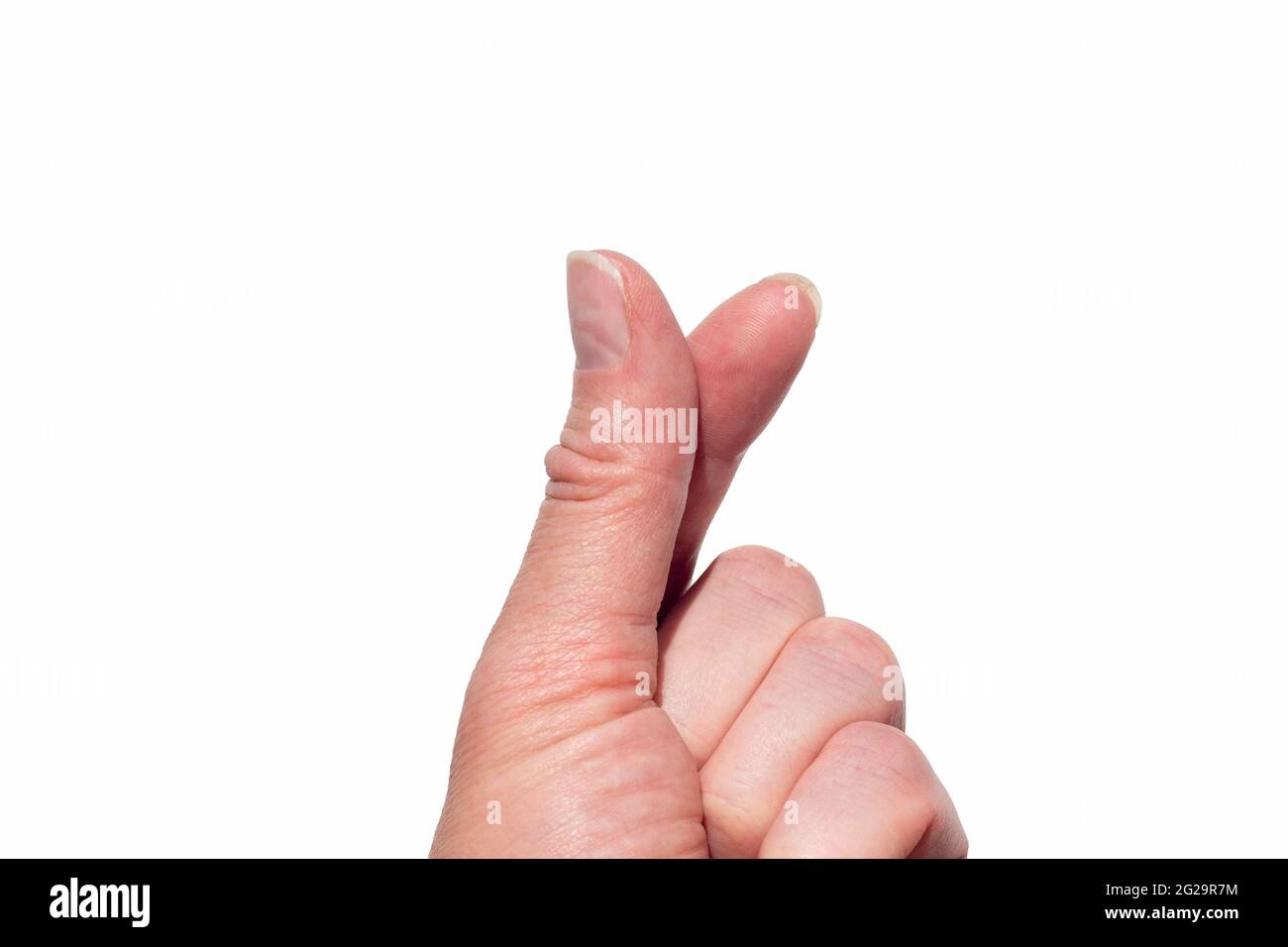 Une main faisant une forme de coeur avec deux doigts sur un fond blanc  isolé. Symbole coréen de l'amour avec les doigts. Cœur du doigt. Mini-main  en forme de coeur Photo Stock 