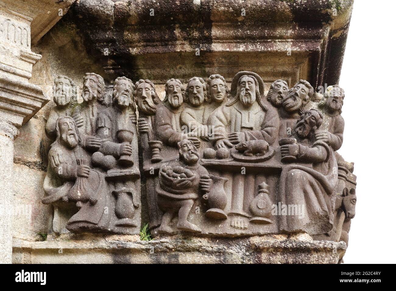 Dernière Cène - détail de la scène sur la pierre Calvaire dans la paroisse proche de Guimiliau, Bretagne, France. Banque D'Images
