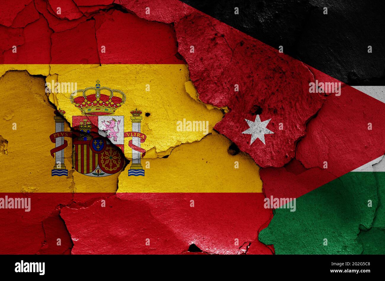 Drapeaux de l'Espagne et de la Jordanie peints sur le mur fissuré Banque D'Images