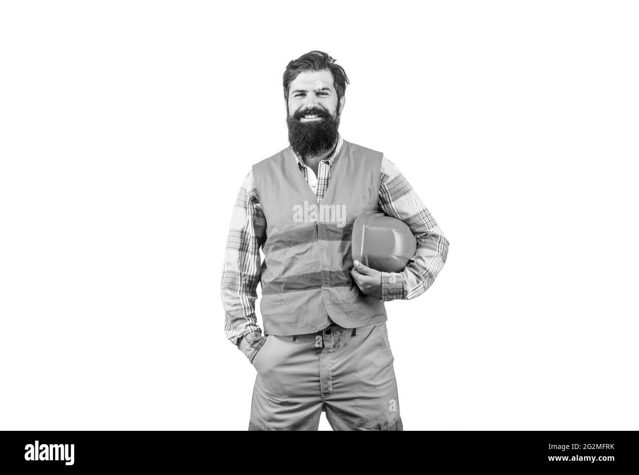 Constructeurs d'hommes, industrie. Constructeur en casque, contremaître ou réparateur dans le casque. Homme barbu travailleur dans un casque ou un casque de chantier. Noir et blanc Banque D'Images