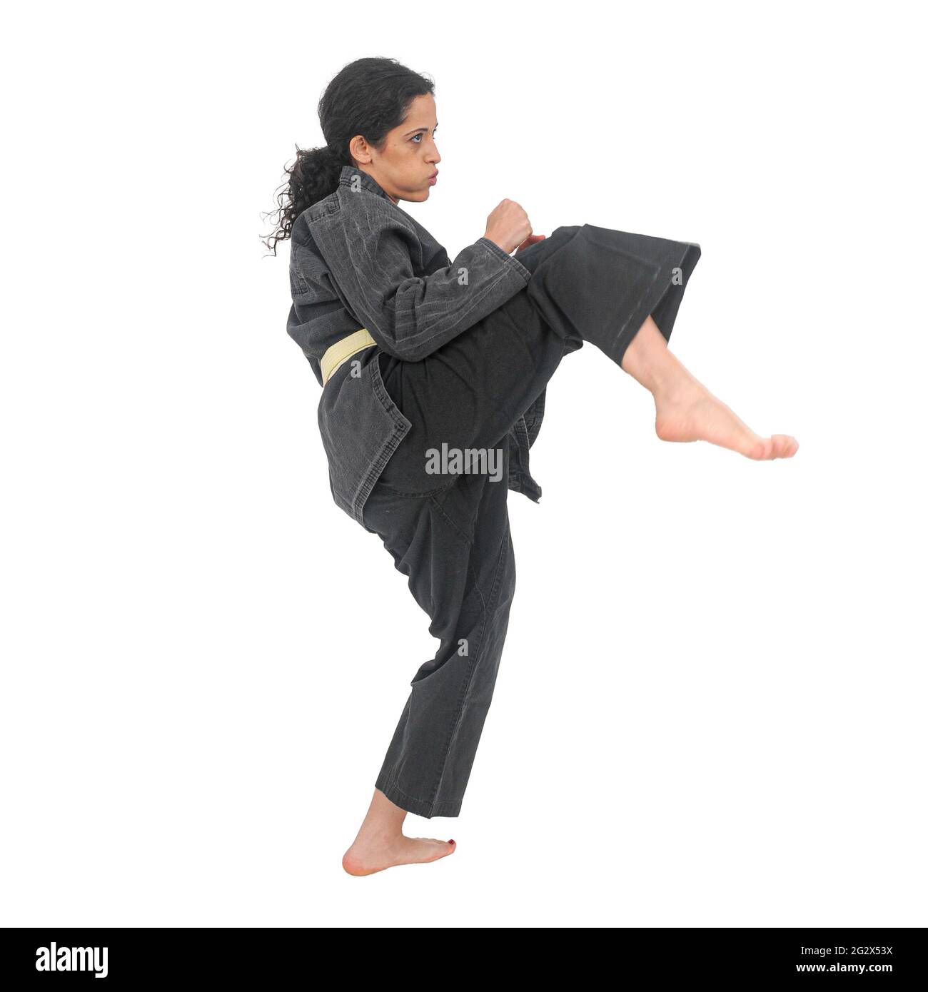 Femmes Martial Arts pratiquant dans un studio sur fond blanc Ilan@IlanPhoto.com Banque D'Images