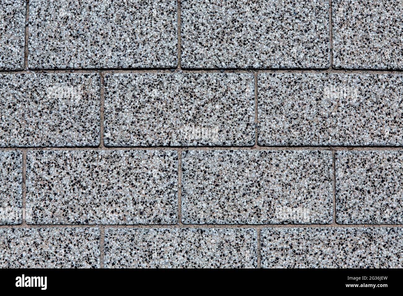 photo en gros plan de sol carrelé avec texture tachetée blanche, noire et grise, placée horizontalement, fonds ou textures de concept Banque D'Images
