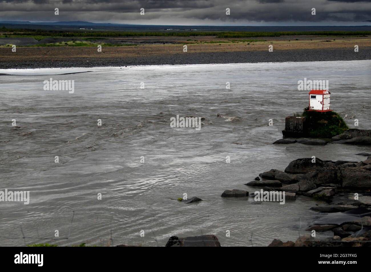 Maison sur pierre dans la rivière, Islande Banque D'Images Maison sur pierre dans la rivière, Islande Banque D'Images
