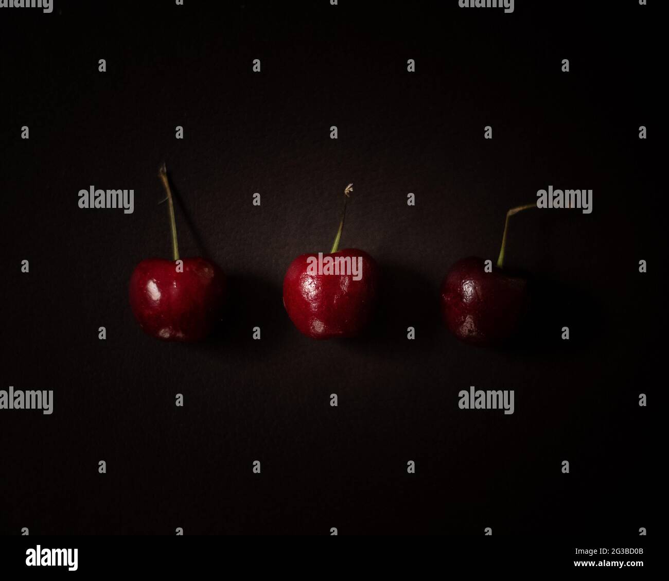 Trois cerises Banque D'Images