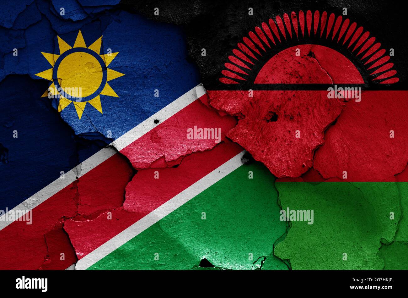 Drapeaux de Namibie et du Malawi peints sur un mur fissuré Banque D'Images