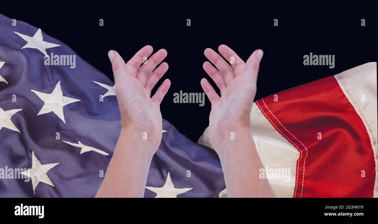 Composition de deux mains accueillantes au-dessus de l'affichage du drapeau américain sur le noir Banque D'Images