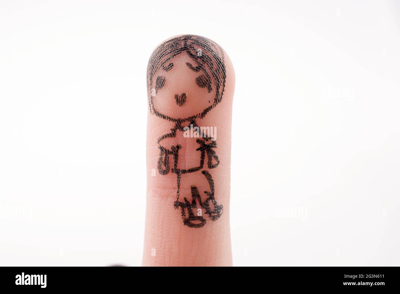 Figure enfant dessinée sur le bout d'un doigt Banque D'Images