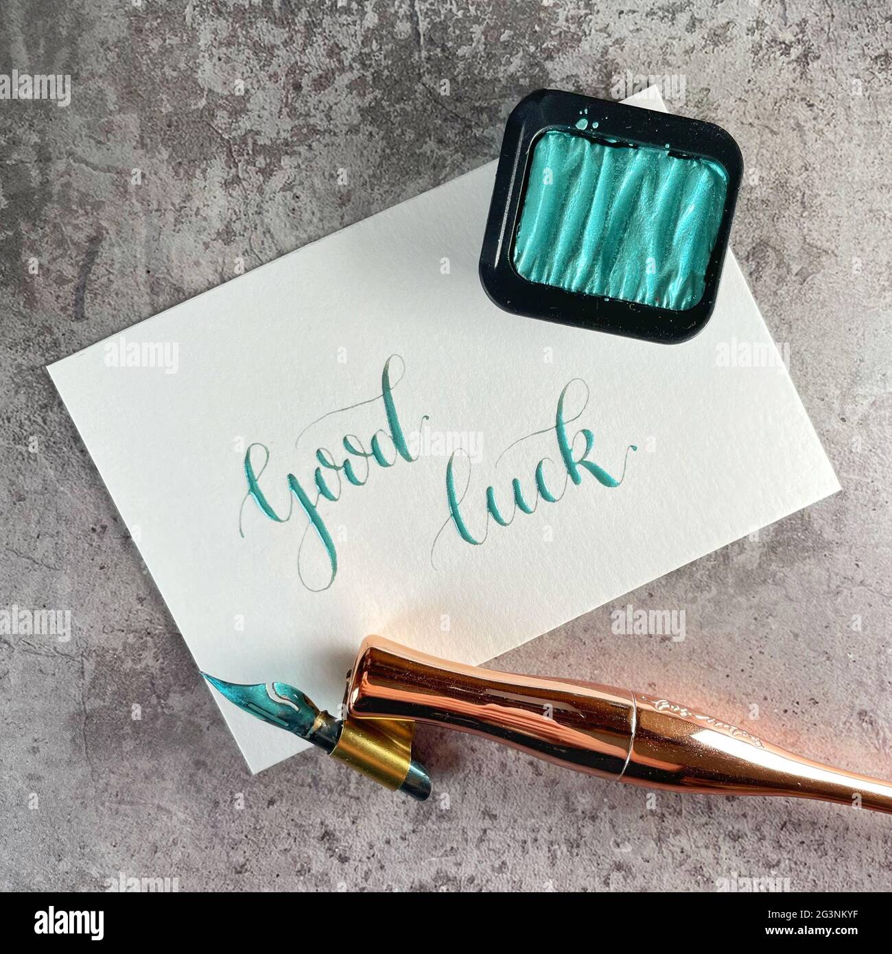 Allez-y et bonne chance - stylo pointe calligraphie avec des aquarelles métalliques Banque D'Images