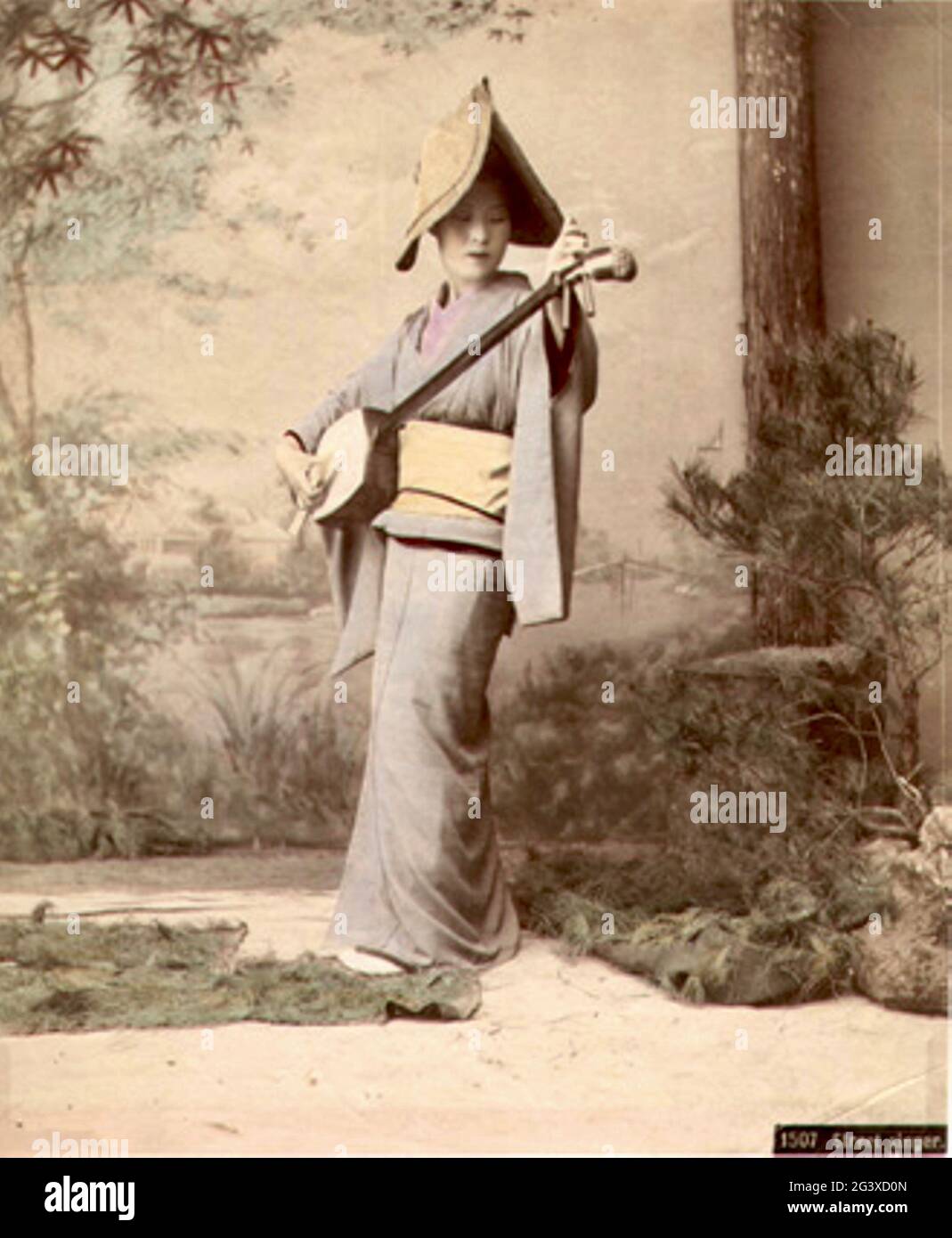 Adolfo Farsari photo japonaise ancienne - chanteur de rue - 1885 Banque D'Images