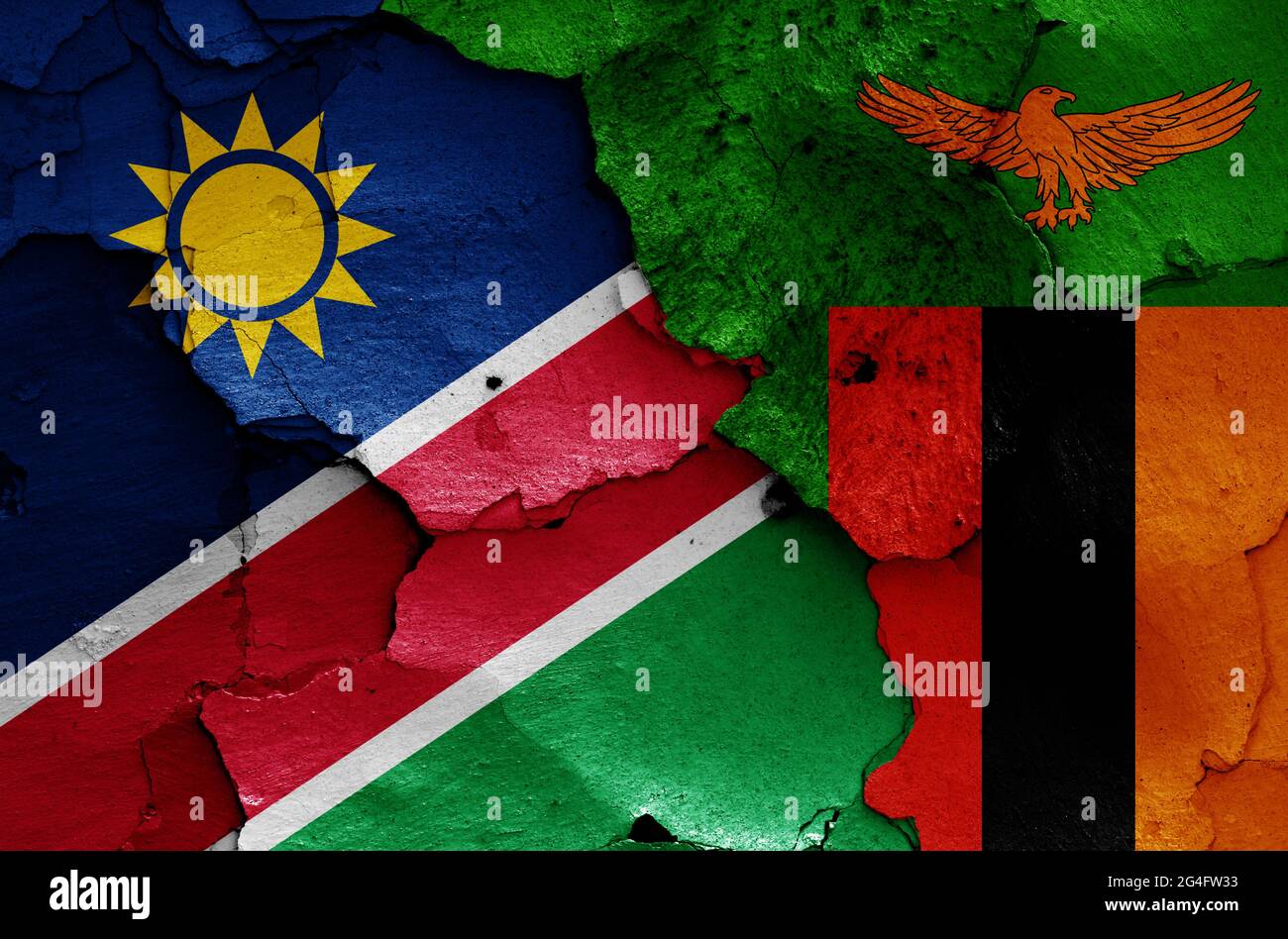 Drapeaux de Namibie et de Zambie peints sur un mur fissuré Banque D'Images