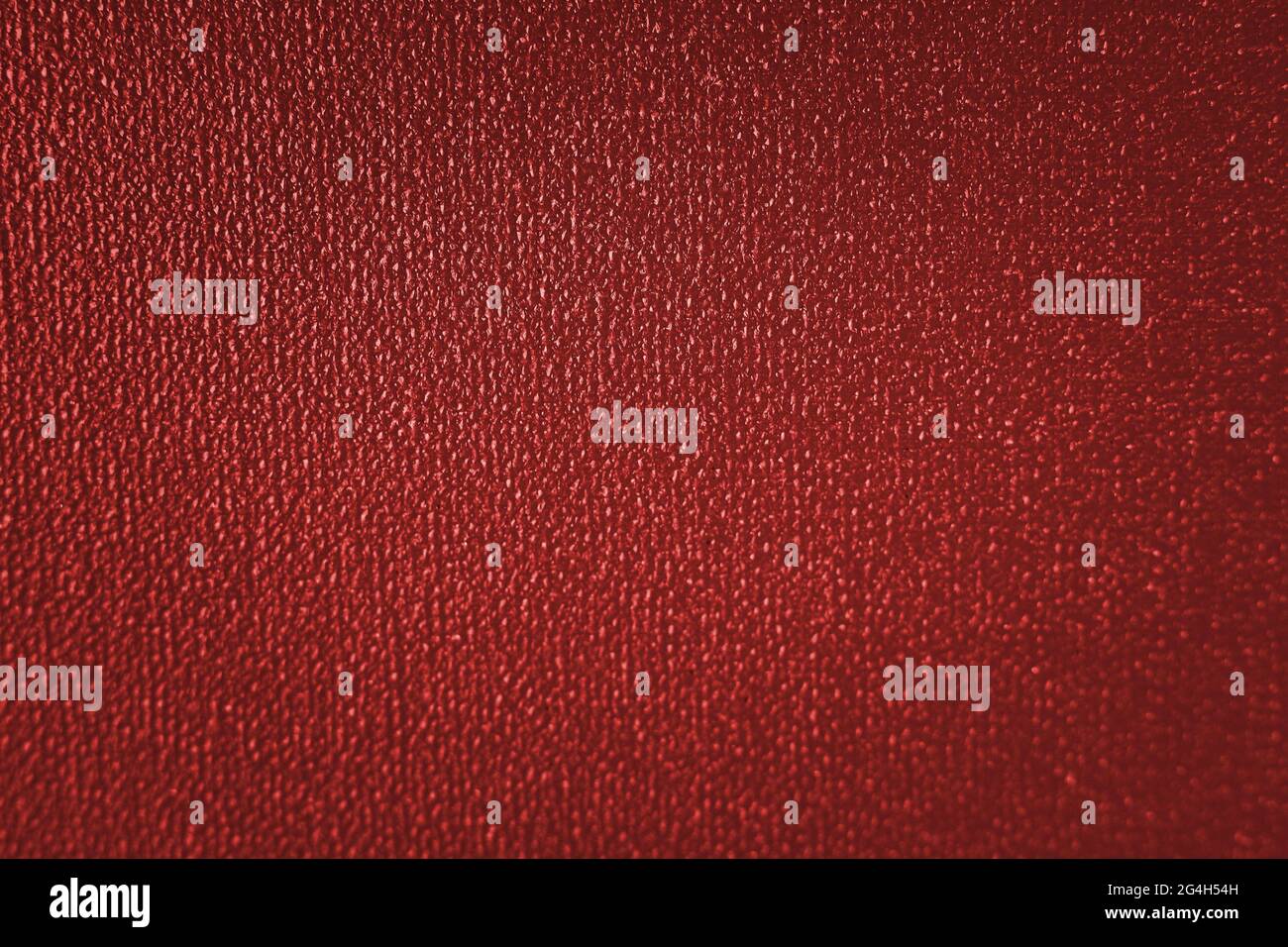 Fond rouge abstrait de mise au point sélective. Arrière-plan classique rouge avec vignette sombre. Fond rouge de Noël. Banque D'Images