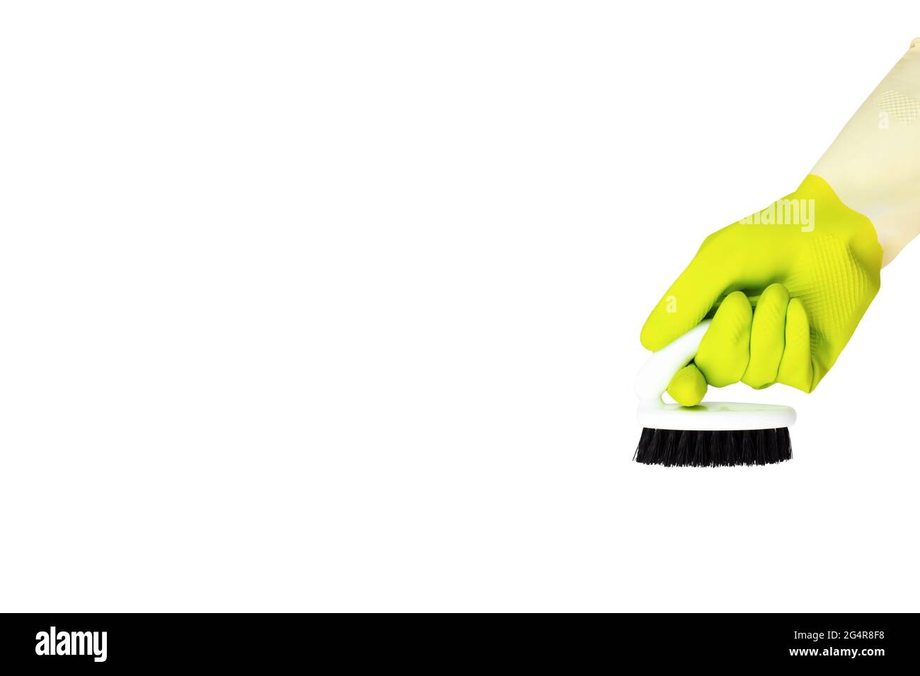 Concept de nettoyage de ressort. Gant de nettoyage jaune avec une brosse isolée sur blanc. Le concept de service de nettoyage Banque D'Images