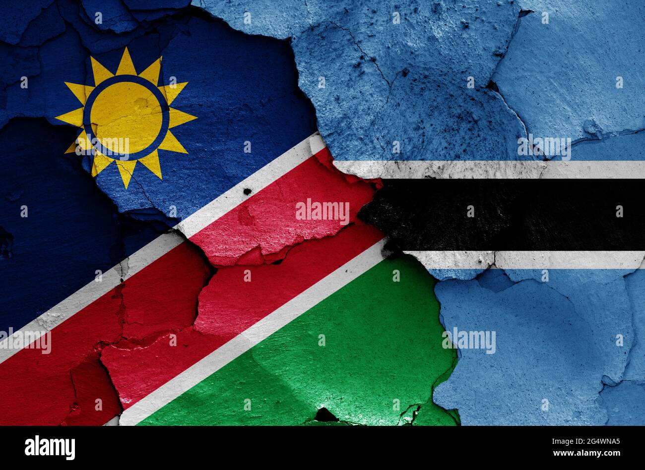 Drapeaux de Namibie et du Botswana peints sur un mur fissuré Banque D'Images