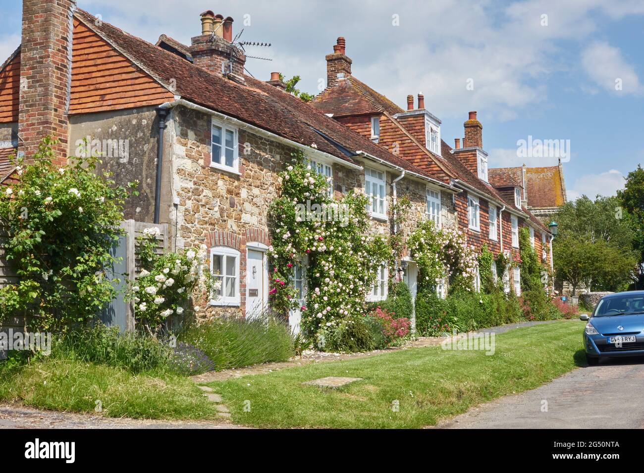 Jolies cottages recouverts de roses à Winchelsea, East Sussex, Royaume-Uni Banque D'Images