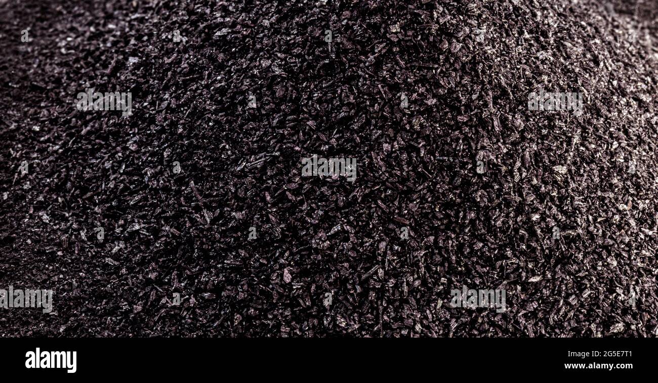 Poudre De Graphite Utilisée Dans L'industrie, Poudre Noire Avec Surface  Blanche Isolée Et Espace De Copie.