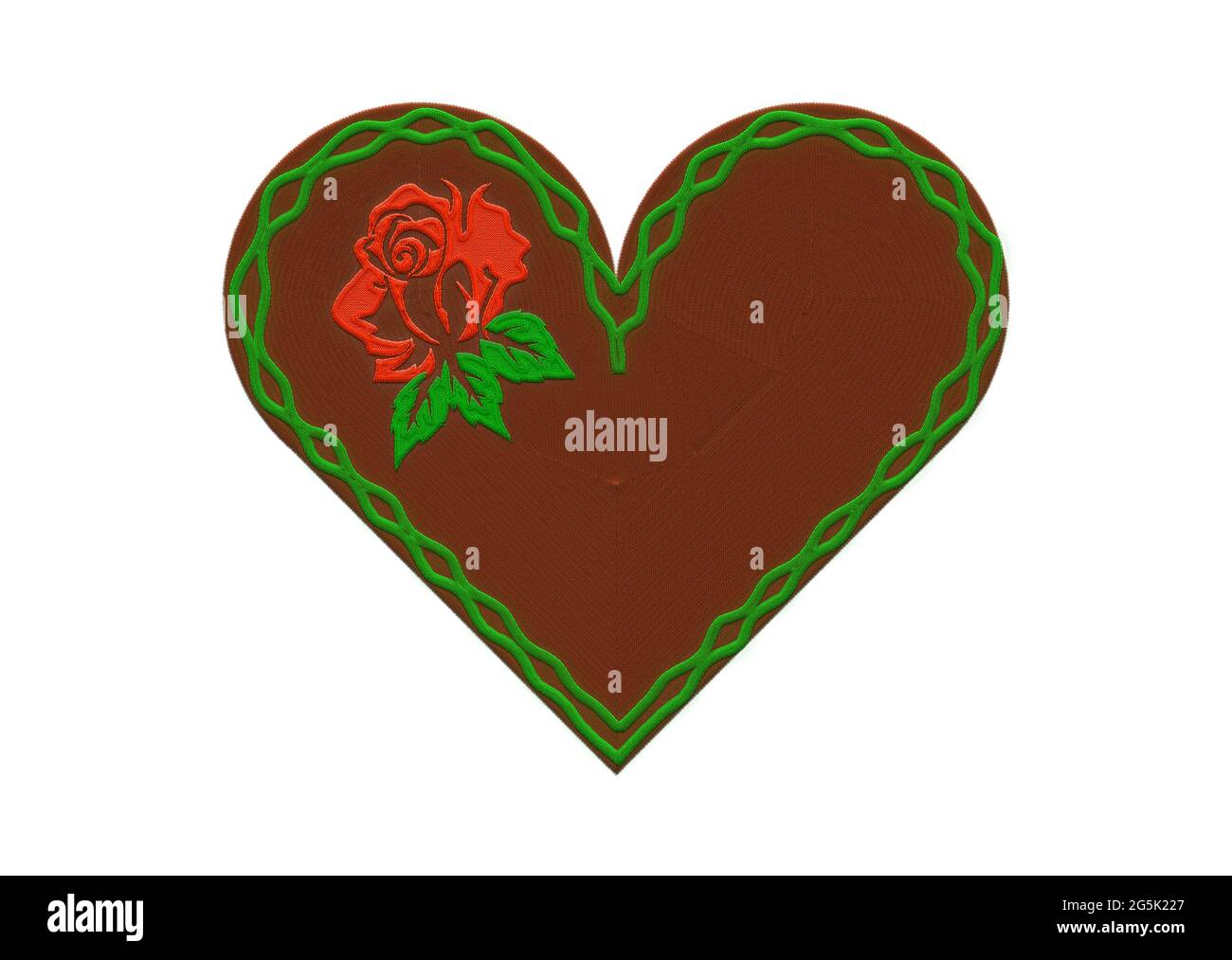 coeur en pain d'épice brodé et rose rouge. Banque D'Images