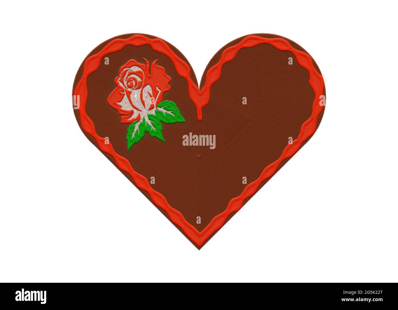 coeur en pain d'épice brodé et rose rouge. Banque D'Images