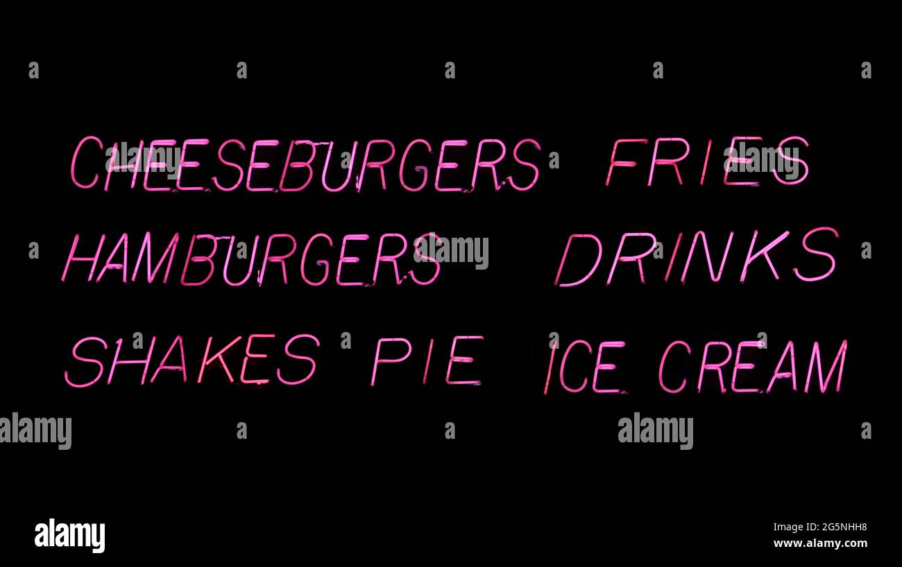 Menu Pink Neon Hamburger Diner dans la fenêtre à la pluie Banque D'Images