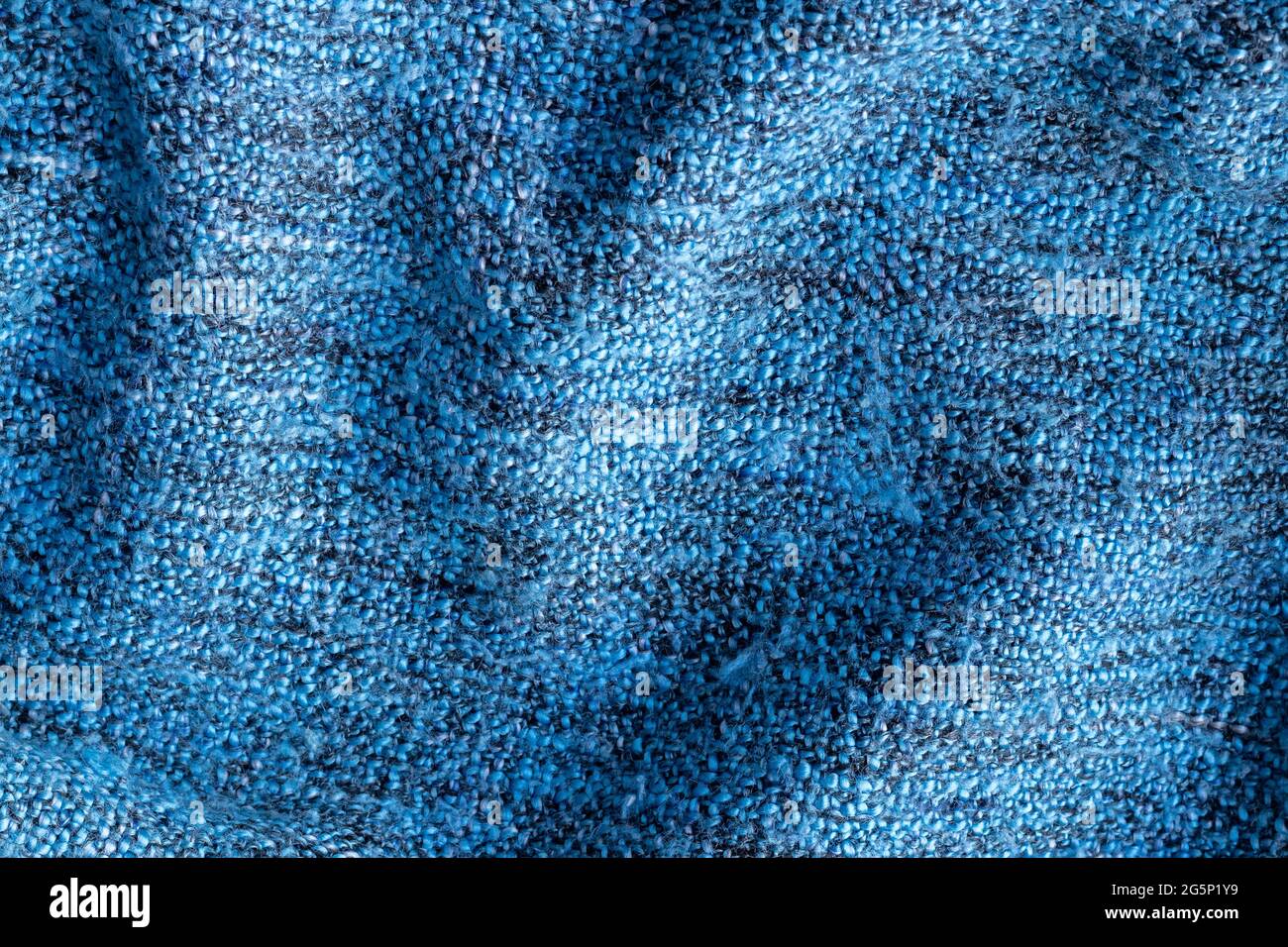 Tissu tricoté bleu. Fond de couverture froissé Banque D'Images